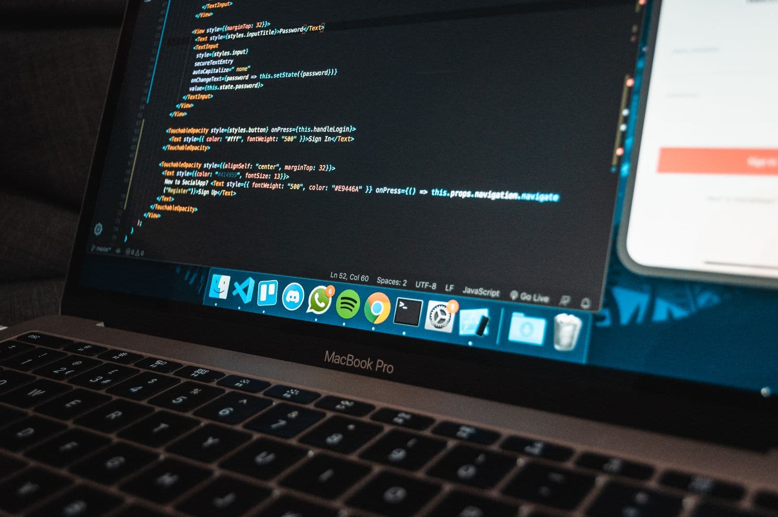 Application code on a laptop, illustrating website development